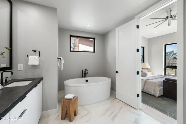 a bathroom with a double vanity sink mirror and double