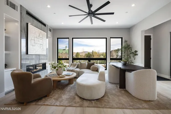 a living room with furniture and a large window