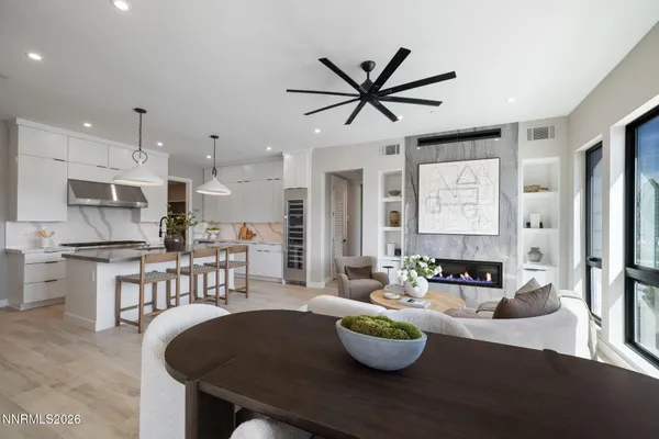 a kitchen with a table chairs and a stove