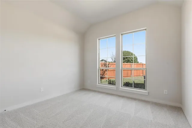 a view of a room that has a bed in it