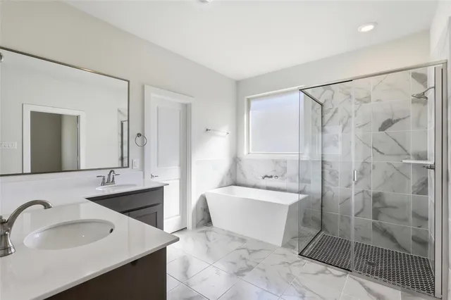 a bathroom with a double vanity sink and mirror