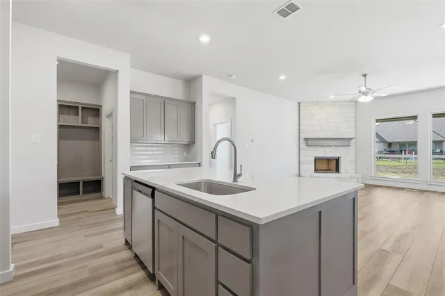 a kitchen with a sink and a refrigerator