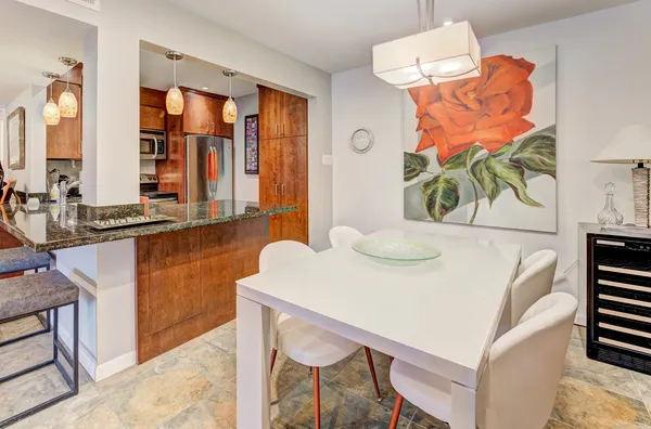 a dining room with furniture and wooden floor