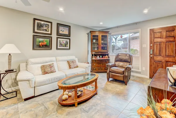 a living room with furniture and a large window
