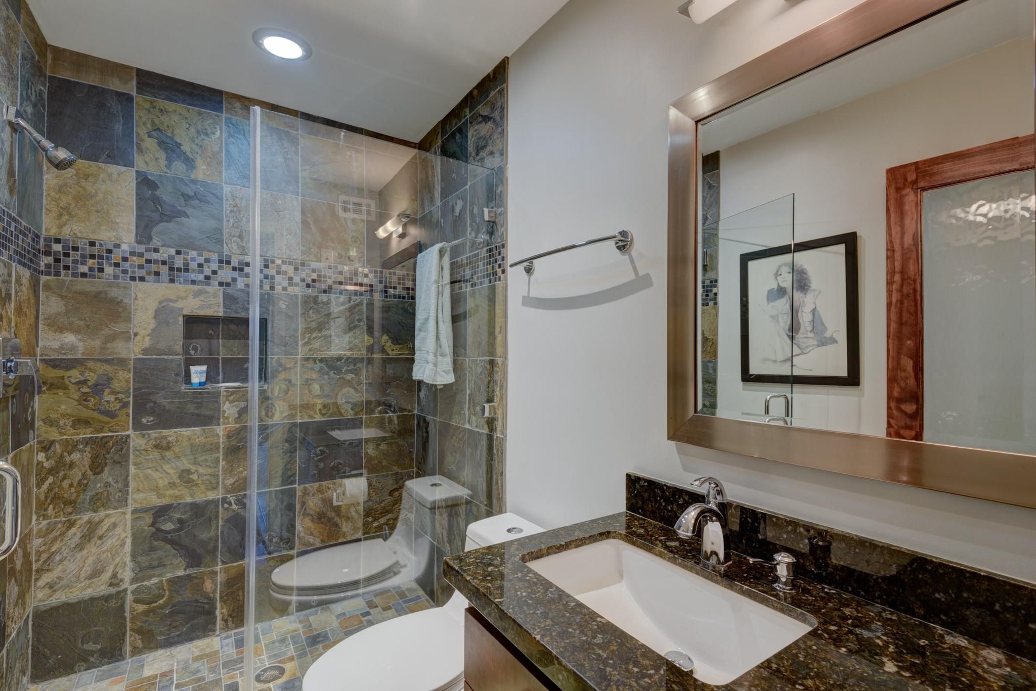 6480 Bayou Glen Road Houston, TX 77057 - Photo 4 of 12 a bathroom with a double vanity sink toilet and shower