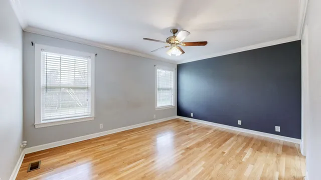 a view of a big room with wooden floor and closet
