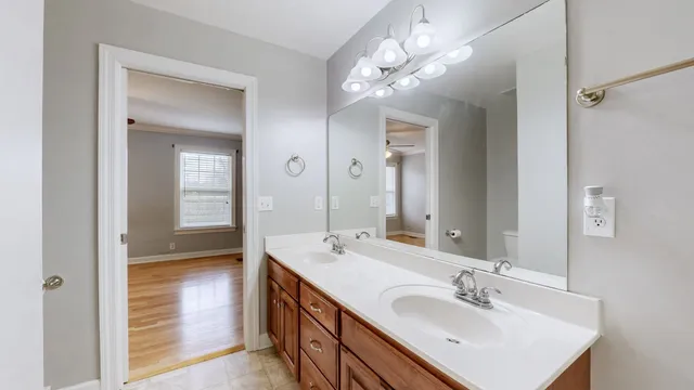a bathroom with a sink and mirror