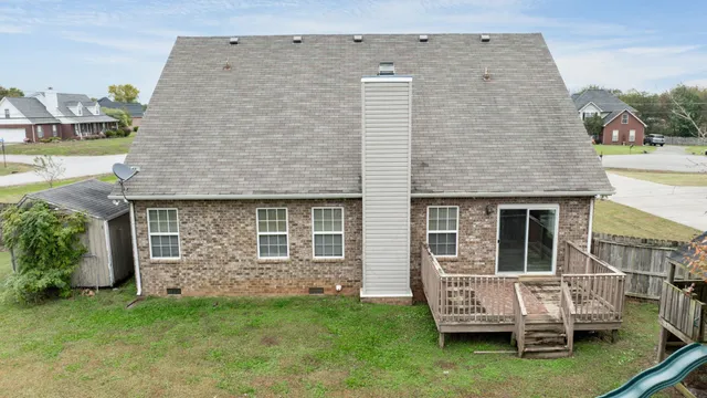 a backyard of a house with barbeque oven