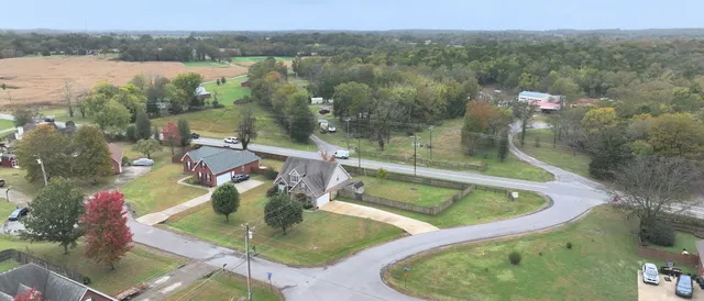 an aerial view of a house with swimming pool