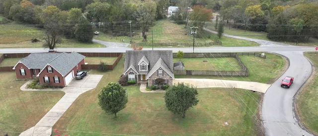 an aerial view of a house with outdoor space