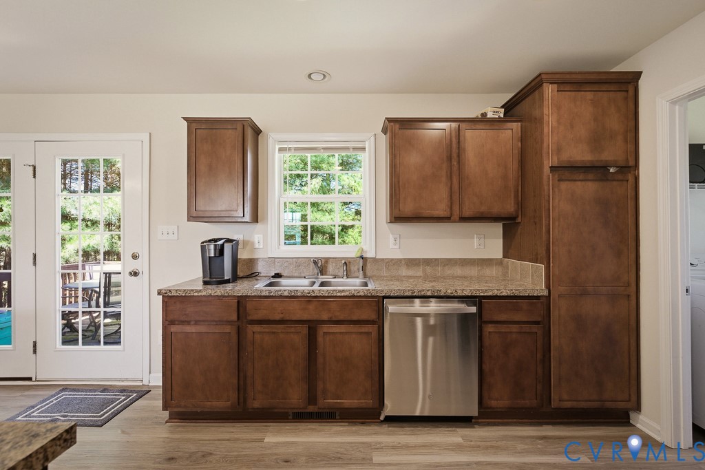 18262 Seals Road Bowling Green, VA 22427 - Photo 24 of 50 a kitchen with stainless steel appliances granite countertop a sink stove and refrigerator