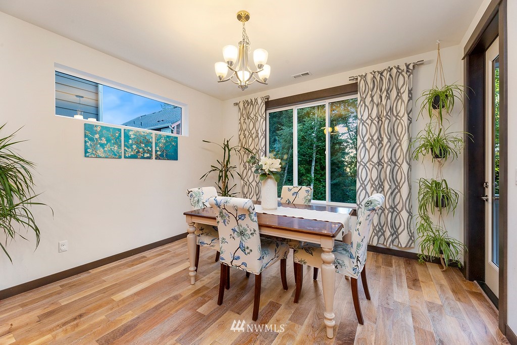 17507 3rd Avenue Southeast Bothell, WA 98012 - Photo 11 of 40 a view of a dining room with furniture window and wooden floor