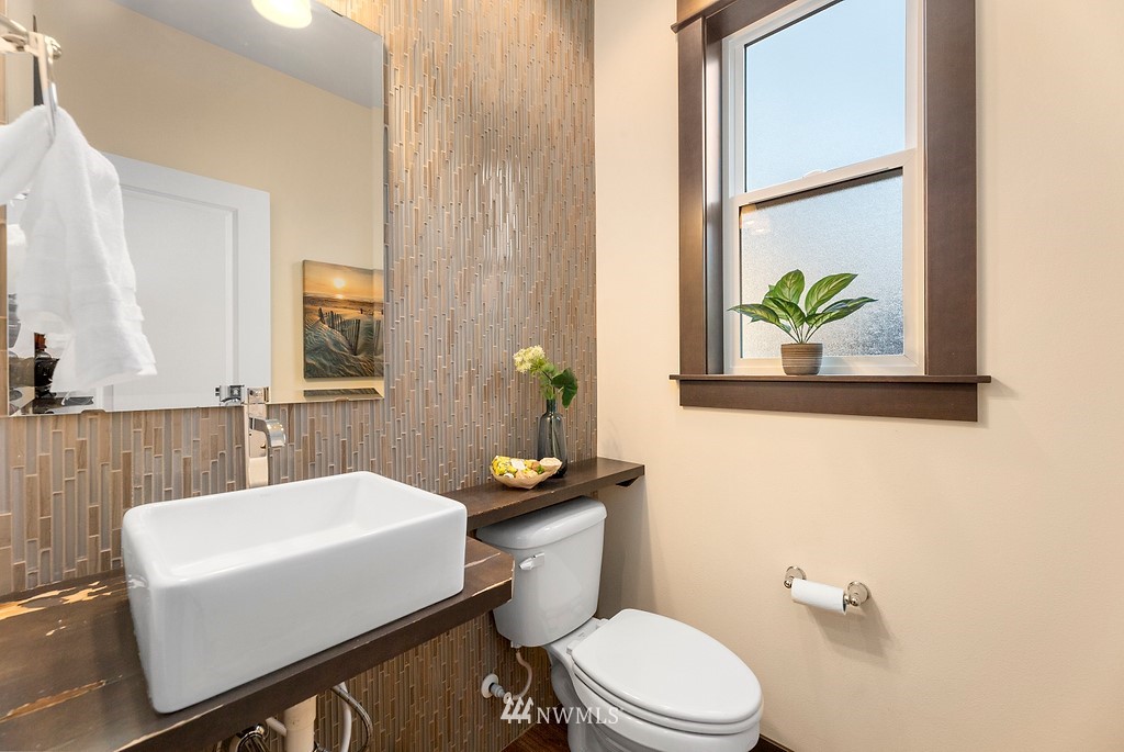 17507 3rd Avenue Southeast Bothell, WA 98012 - Photo 12 of 40 a bathroom with a sink a toilet and mirror
