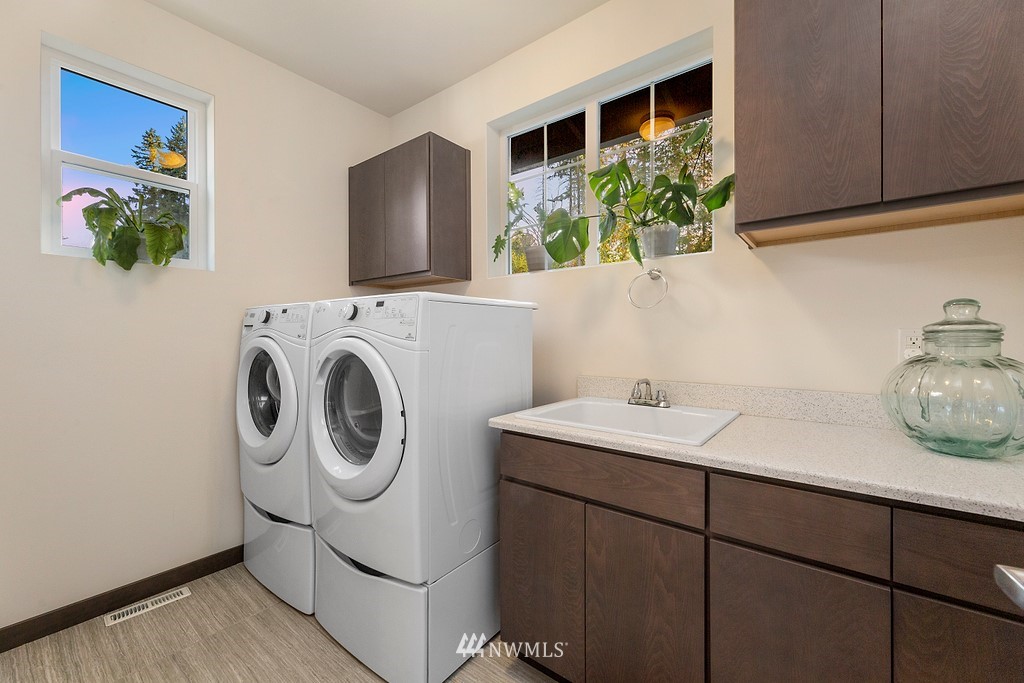17507 3rd Avenue Southeast Bothell, WA 98012 - Photo 14 of 40 a utility room with sink dryer and washer