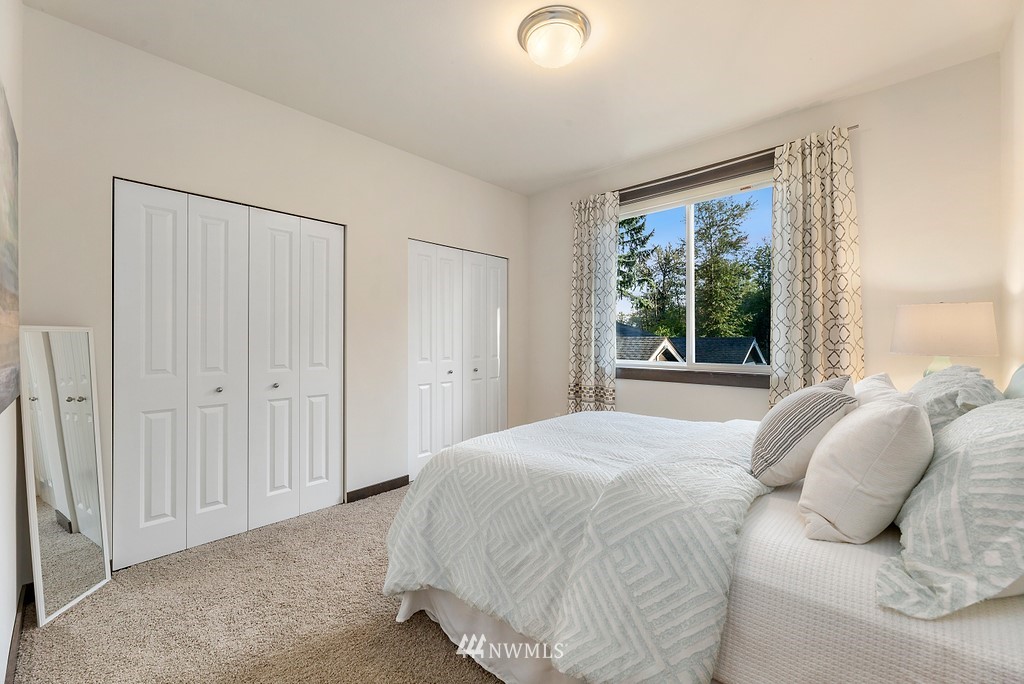 17507 3rd Avenue Southeast Bothell, WA 98012 - Photo 16 of 40 a bedroom with a bed and a window