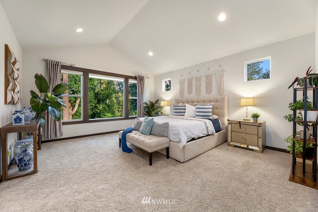 17507 3rd Avenue Southeast Bothell, WA 98012 - Photo 19 of 40 a spacious bedroom with a bed and a large window