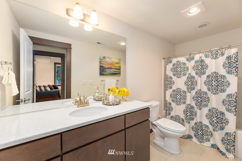 17507 3rd Avenue Southeast Bothell, WA 98012 - Photo 25 of 40 a bathroom with a sink mirror vanity and toilet