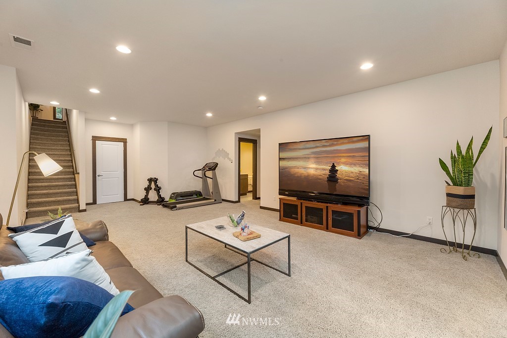 17507 3rd Avenue Southeast Bothell, WA 98012 - Photo 26 of 40 a living room with furniture and a flat screen tv