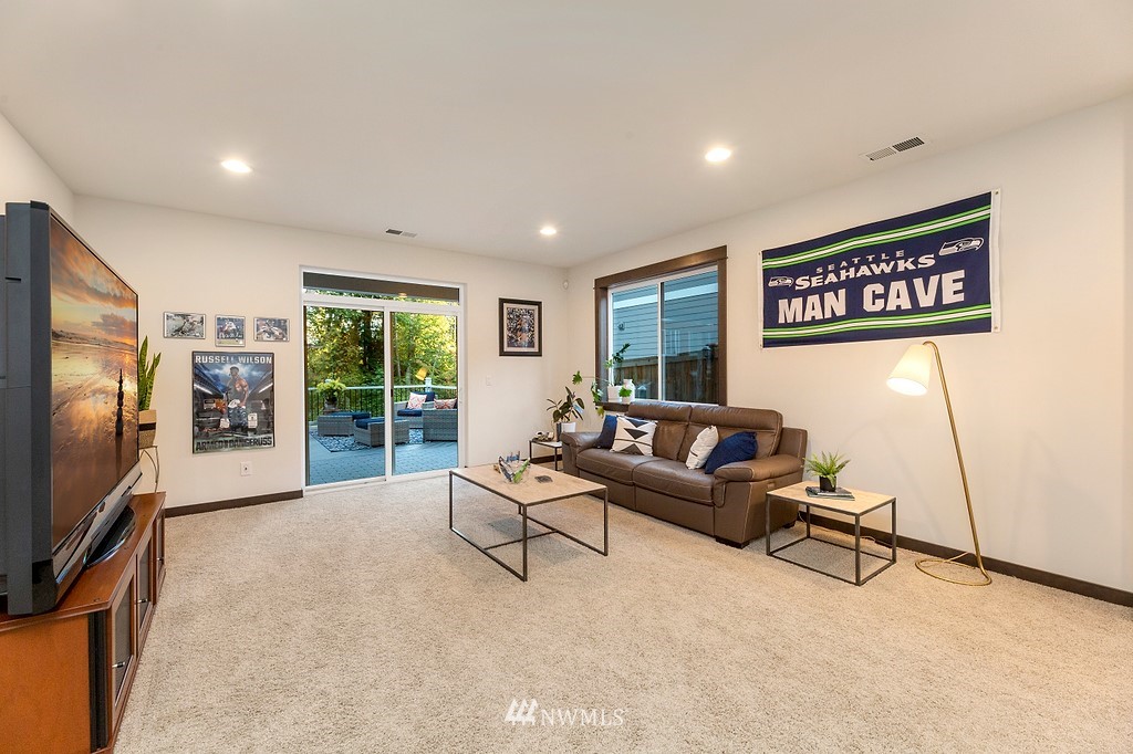 17507 3rd Avenue Southeast Bothell, WA 98012 - Photo 27 of 40 a living room with furniture and a flat screen tv