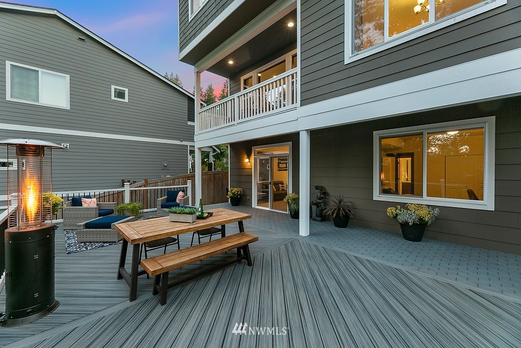 17507 3rd Avenue Southeast Bothell, WA 98012 - Photo 30 of 40 a backyard of a house with barbeque oven table and chairs