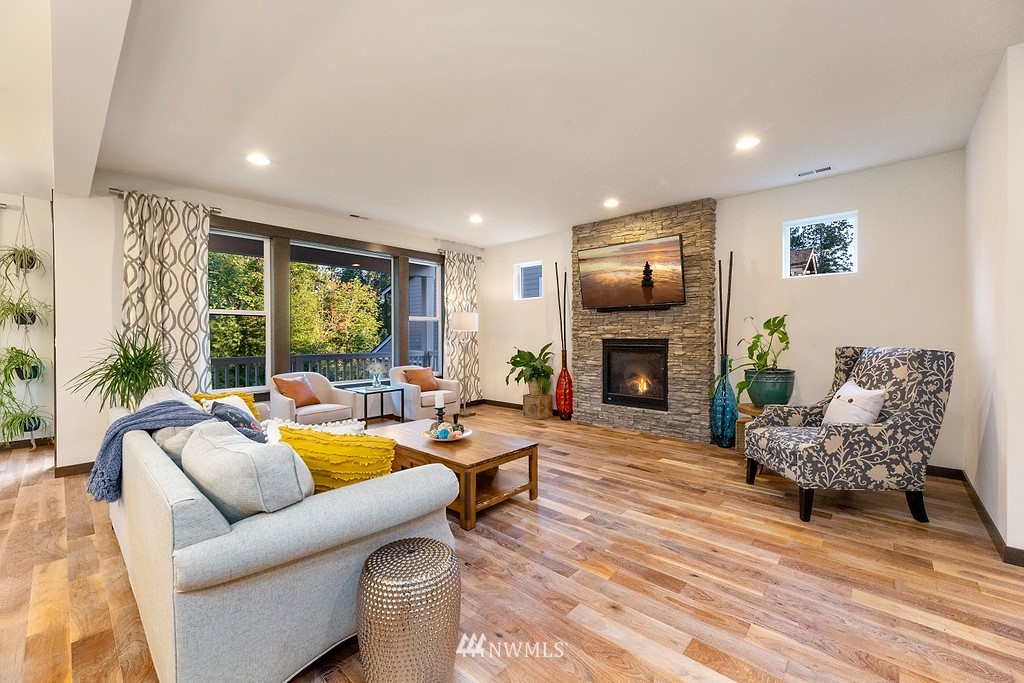 17507 3rd Avenue Southeast Bothell, WA 98012 - Photo 4 of 40 a living room with furniture fireplace and a large window