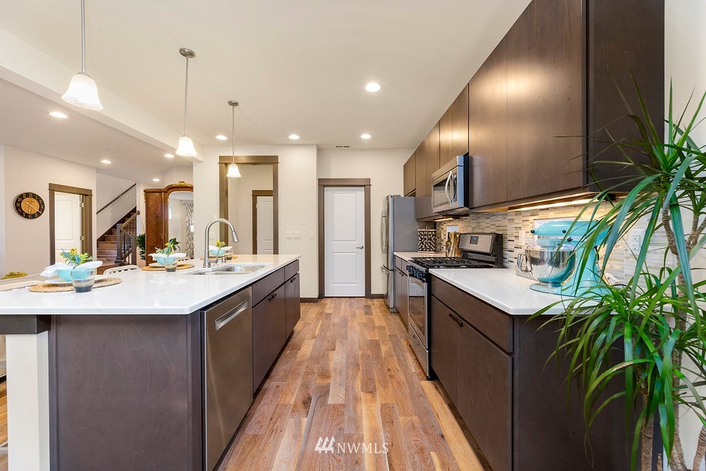 17507 3rd Avenue Southeast Bothell, WA 98012 - Photo 10 of 40 a kitchen with counter top space sink and center island