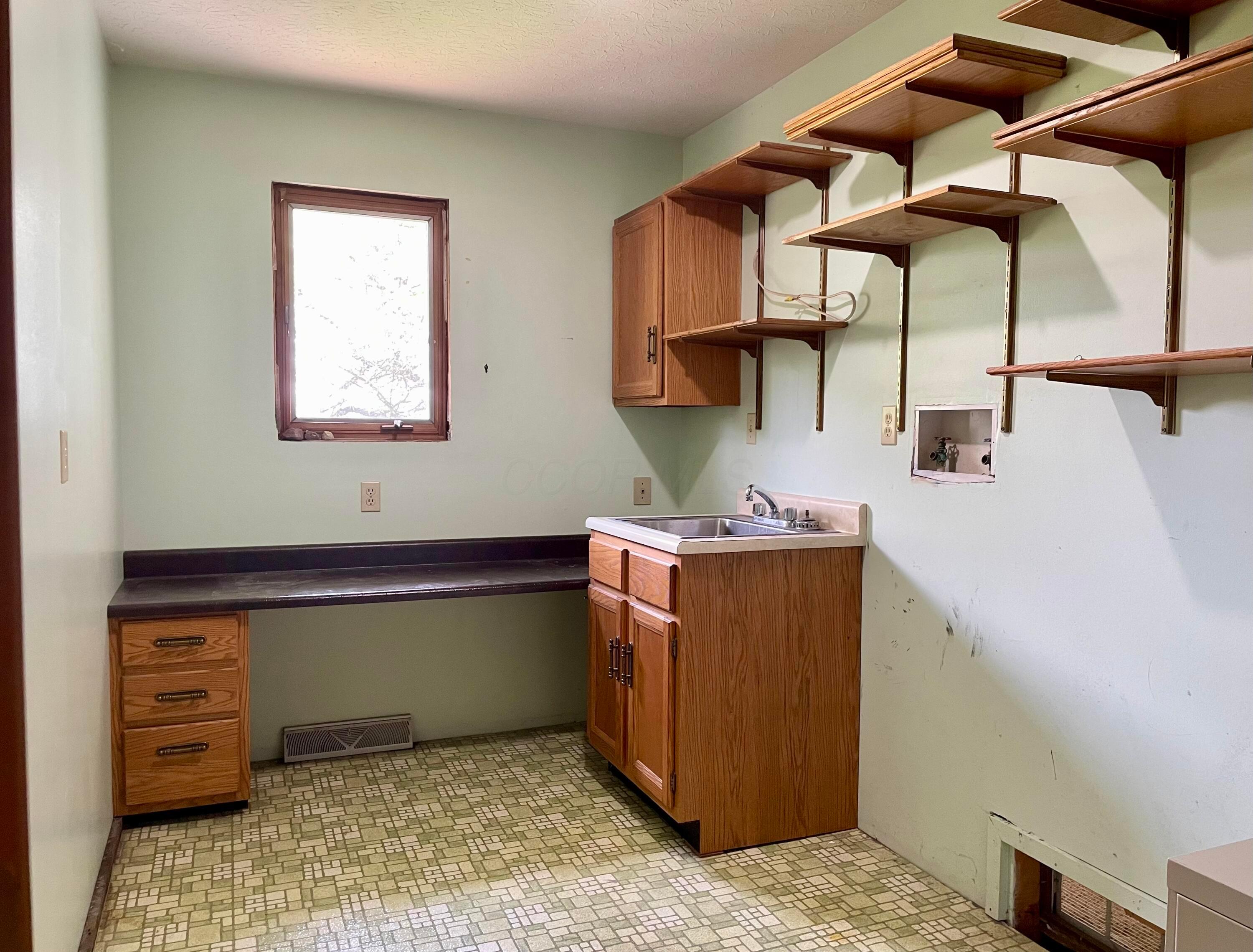 13480 Robins Road Westerville, OH 43082 - Photo 29 of 46 First floor laundry room view.