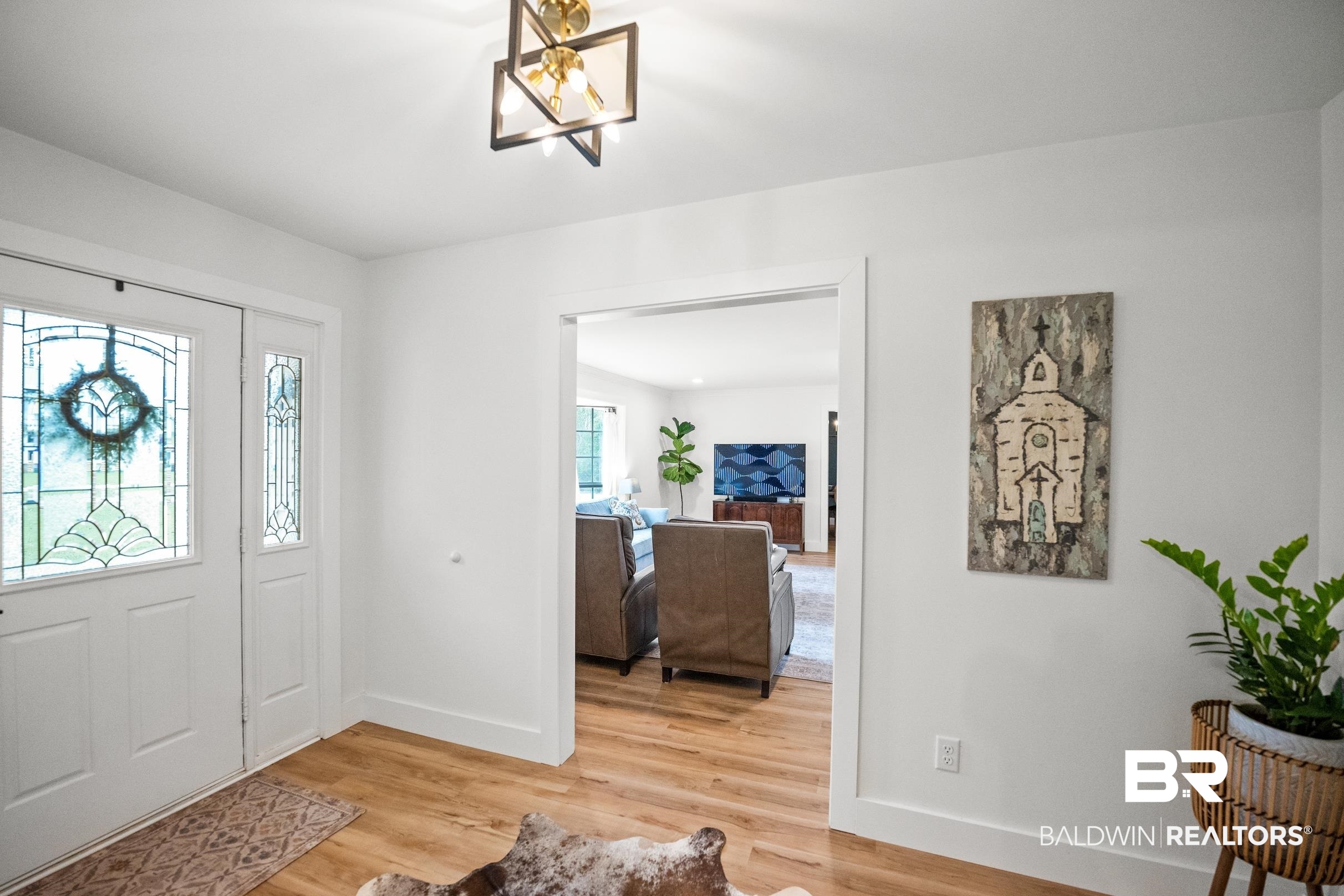 6 Wren Circle Foley, AL 36535 - Photo 5 of 55 Entryway featuring a chandelier, baseboards, and light wood-style flooring