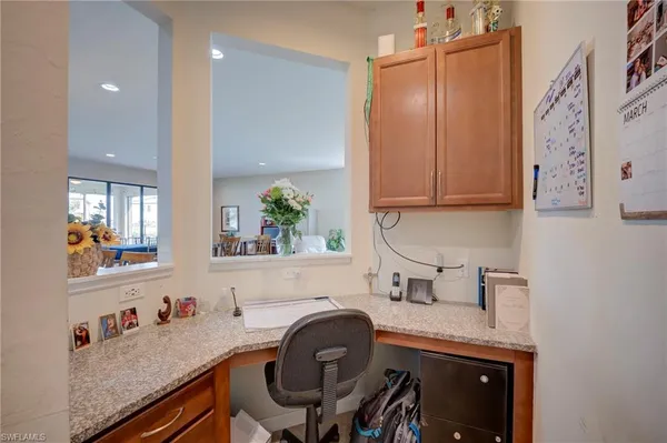 a room with a sink cabinets and window