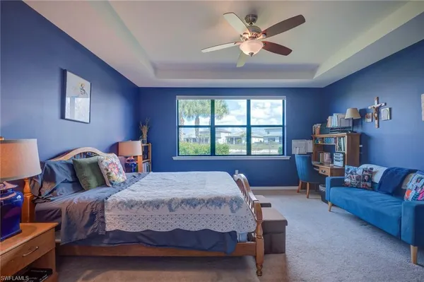 a bedroom with a large bed and a couch