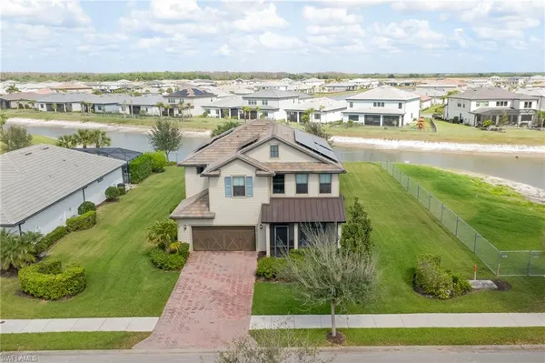 an aerial view of a house with a ocean view