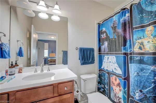 a bathroom with a sink and a washing machine