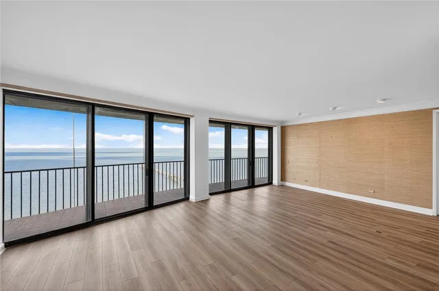 a kitchen with white cabinets and sink