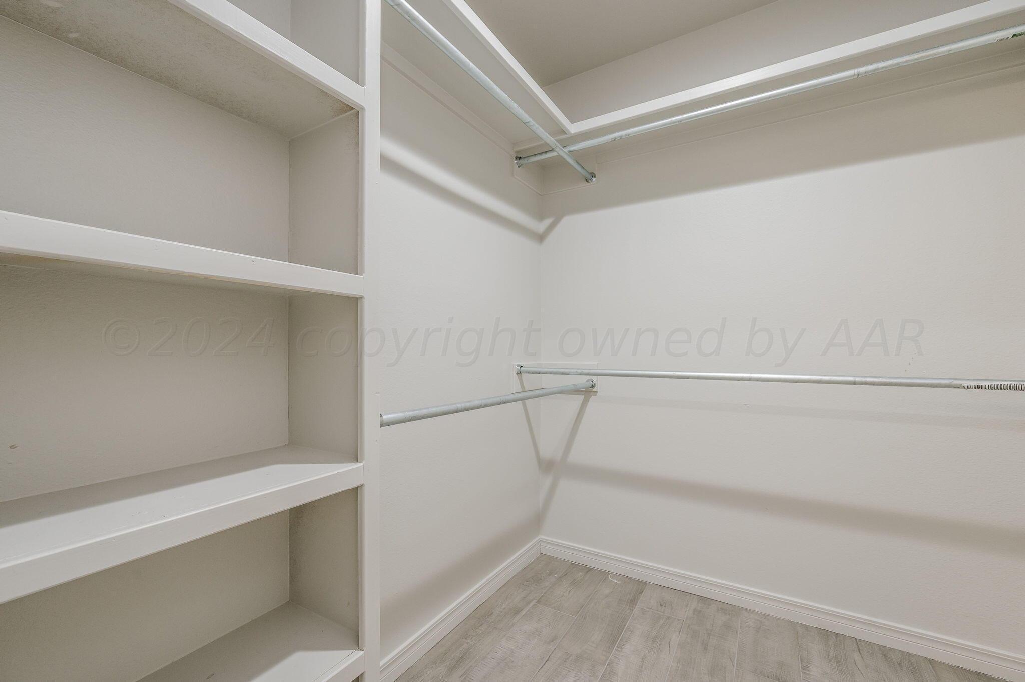13987 Periwinkle Drive, Unit 1 Amarillo, TX 79119 - Photo 13 of 20 a view of an empty walk in closet