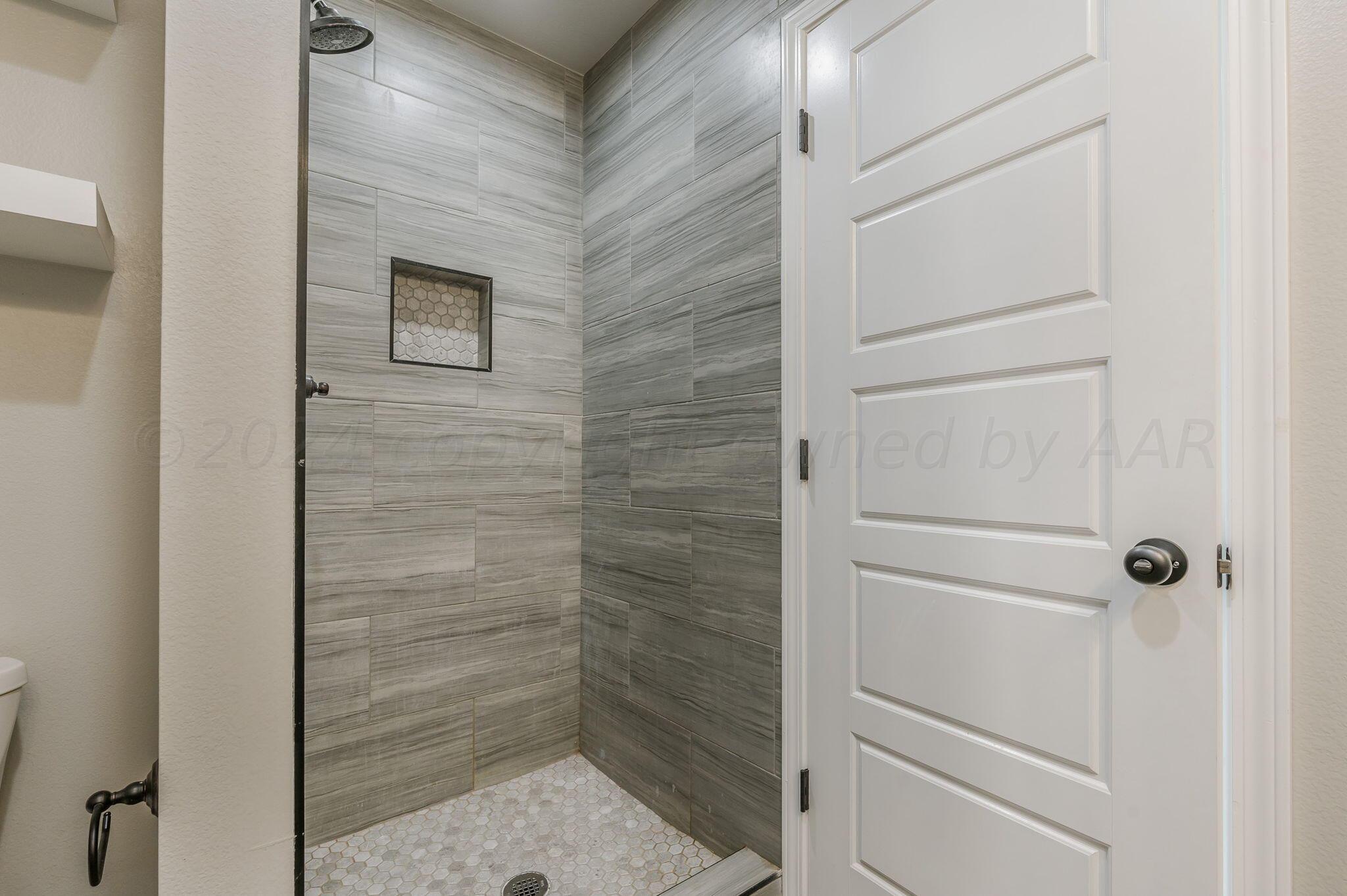 13987 Periwinkle Drive, Unit 1 Amarillo, TX 79119 - Photo 15 of 20 a bathroom with a shower