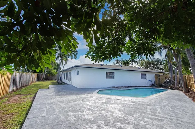 a house view with a backyard space