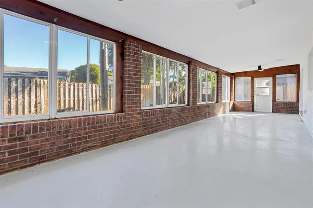 a view of an empty room with a large window