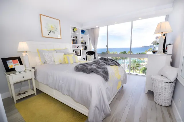 a bedroom with a bed and a night stand