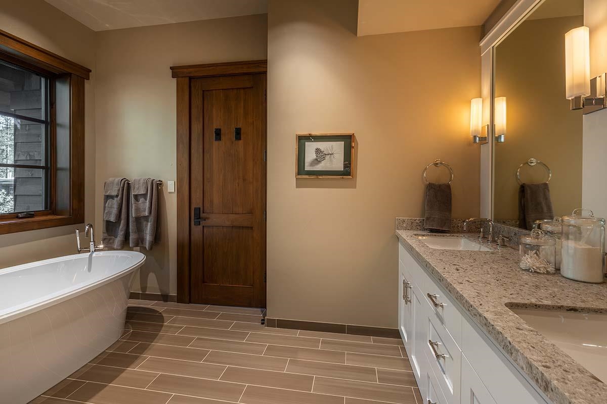 8094 Fallen Leaf Way Truckee, CA 96161 - Photo 14 of 28 a bathroom with a granite countertop sink and a bathtub