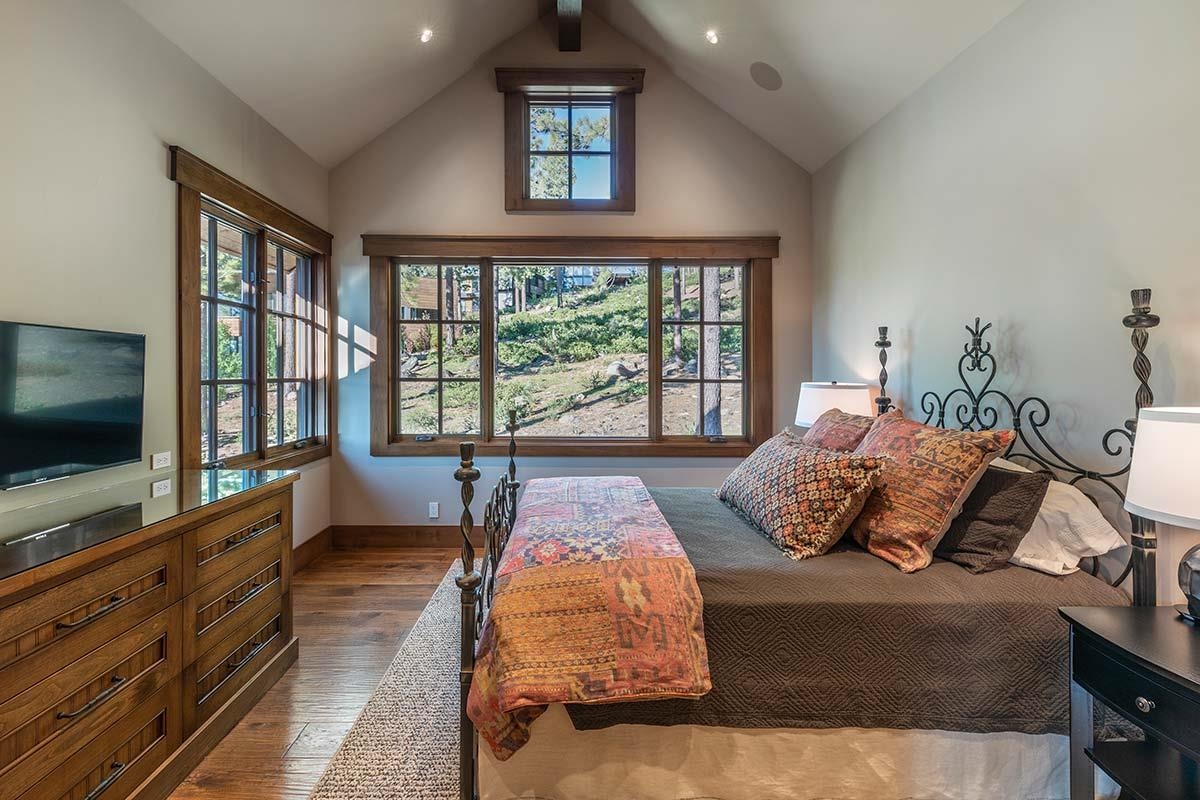 8094 Fallen Leaf Way Truckee, CA 96161 - Photo 23 of 28 a living room with couches bookshelf and a flat screen tv