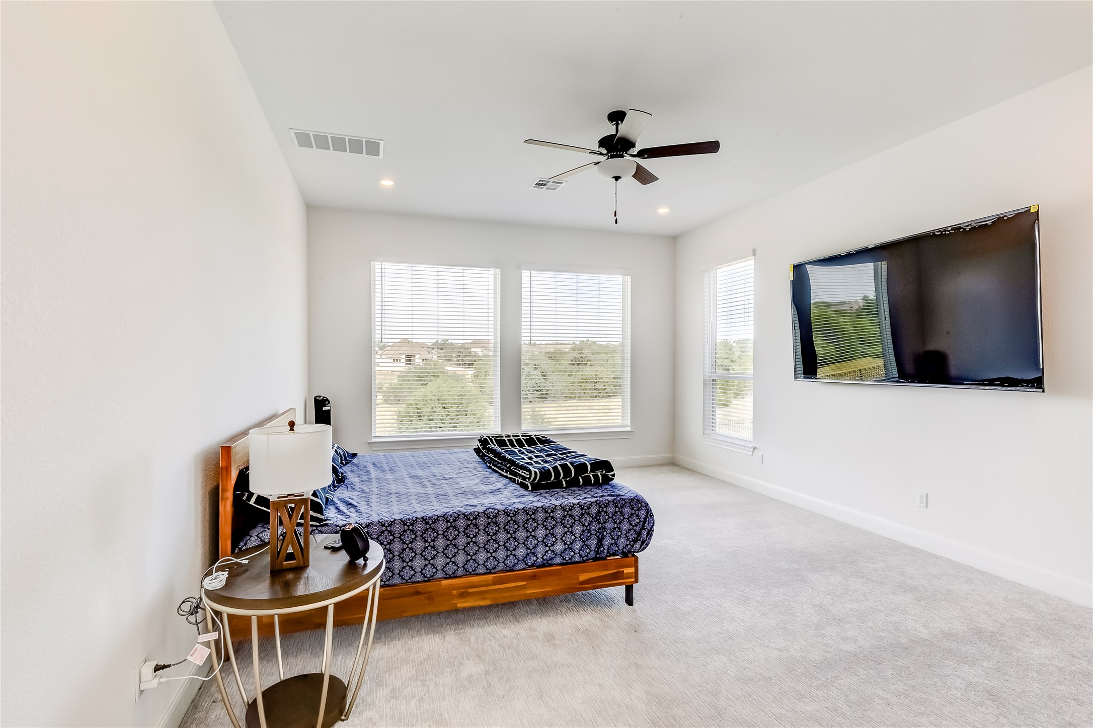 462 Old Stone Road Austin, TX 78737 - Photo 24 of 39 Carpeted bedroom featuring baseboards and ceiling fan