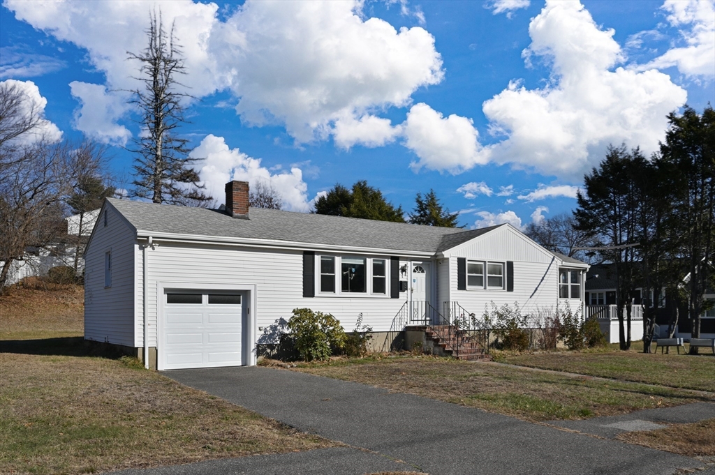 3 Athens Drive Saugus, MA 01906 - Photo 1 of 33 a front view of a house with a yard and garage