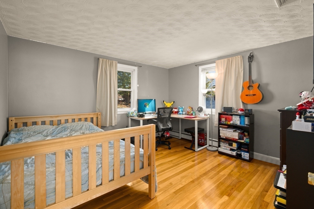 3 Athens Drive Saugus, MA 01906 - Photo 13 of 33 a bedroom with furniture and a wooden floor