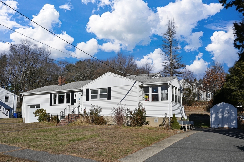 3 Athens Drive Saugus, MA 01906 - Photo 2 of 33 a view of a white house next to a yard with big trees