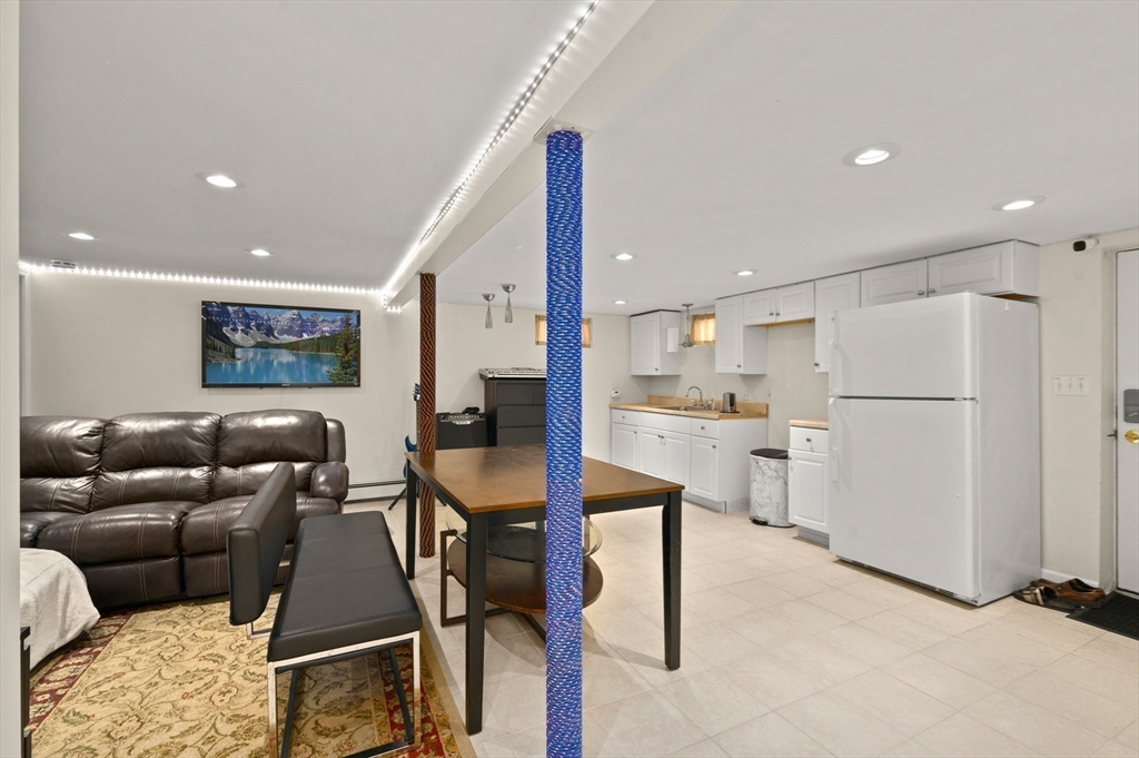 3 Athens Drive Saugus, MA 01906 - Photo 22 of 33 a living room with furniture and kitchen view