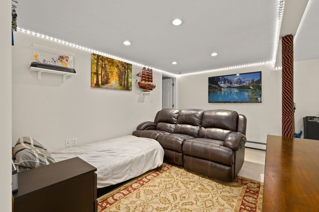3 Athens Drive Saugus, MA 01906 - Photo 25 of 33 a living room with furniture and a flat screen tv