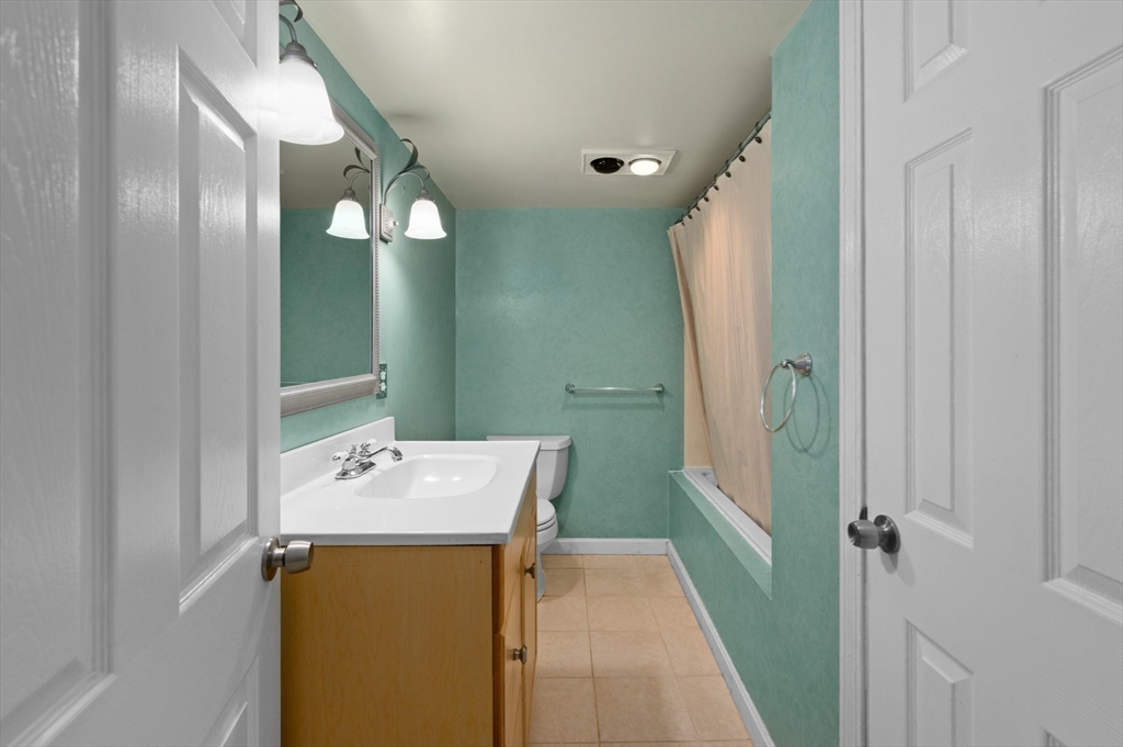 3 Athens Drive Saugus, MA 01906 - Photo 26 of 33 a bathroom with a sink vanity and a mirror