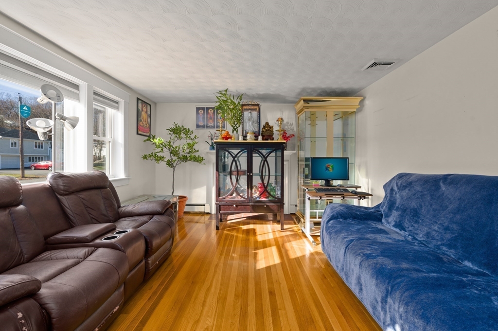 3 Athens Drive Saugus, MA 01906 - Photo 9 of 33 a living room with furniture and a wooden floor