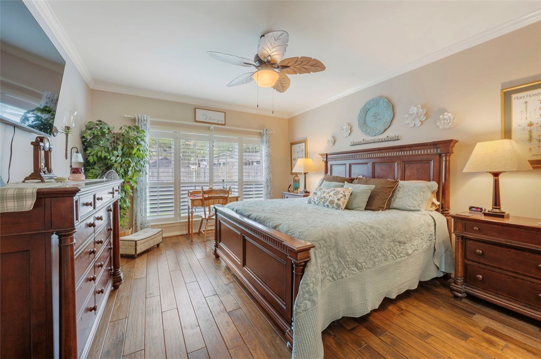 1400 Gun And Rod Road Brenham, TX 77833 - Photo 11 of 23 a bed room with a bed and a chandelier