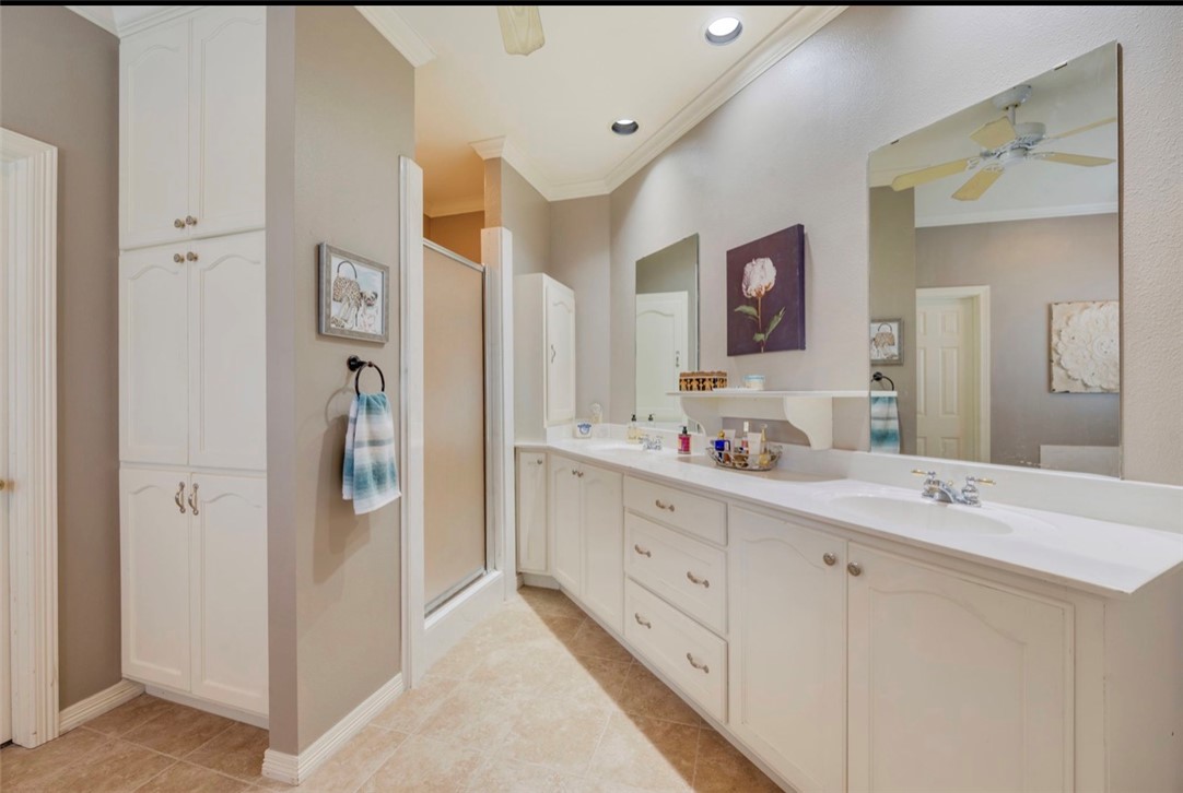 1400 Gun And Rod Road Brenham, TX 77833 - Photo 12 of 23 a bathroom with a double vanity sink mirror and